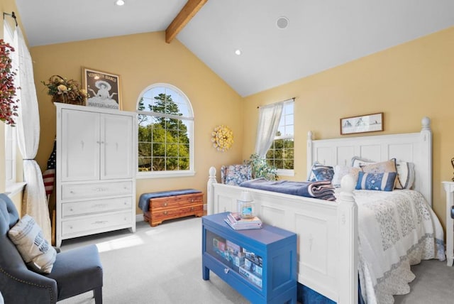 bedroom featuring light carpet and lofted ceiling with beams