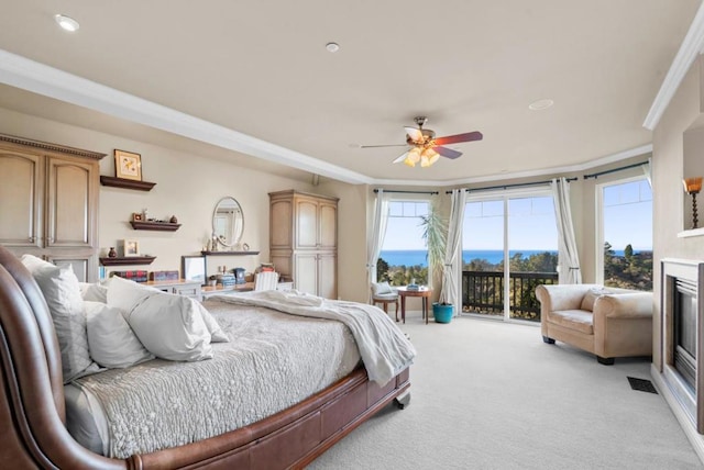 bedroom with access to exterior, crown molding, light colored carpet, and ceiling fan