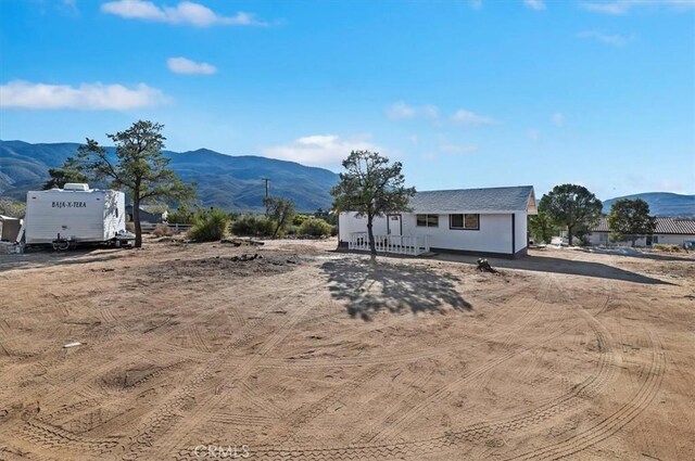 exterior space with a mountain view and a garage