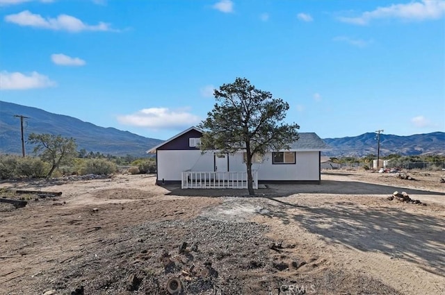 exterior space featuring a mountain view