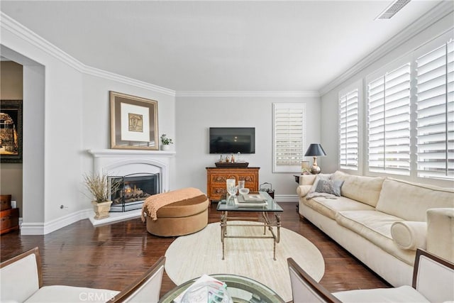 living room featuring dark hardwood / wood-style flooring and ornamental molding