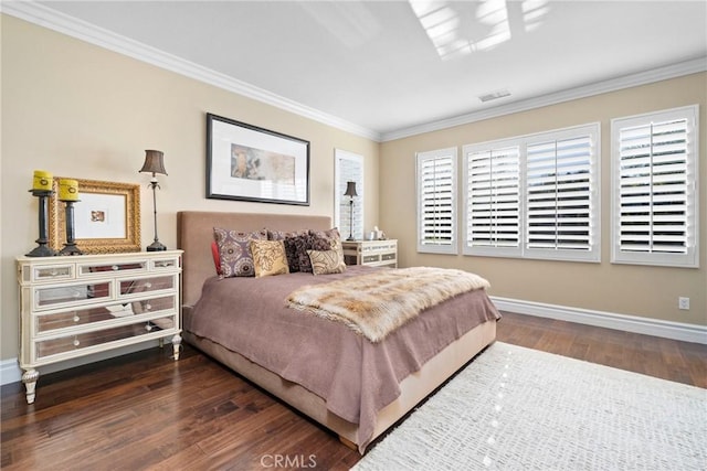 bedroom with ornamental molding and dark hardwood / wood-style floors