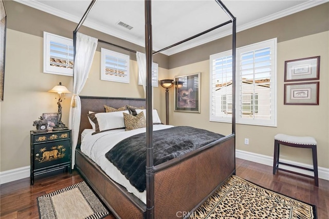 bedroom featuring dark hardwood / wood-style flooring and crown molding