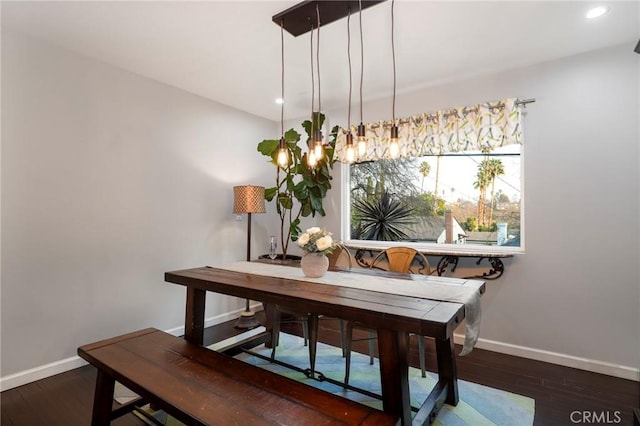 dining room with dark hardwood / wood-style flooring