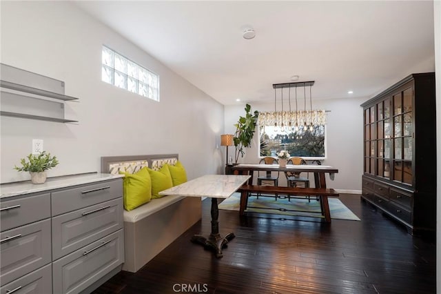 dining space featuring dark wood-type flooring, a wealth of natural light, and breakfast area