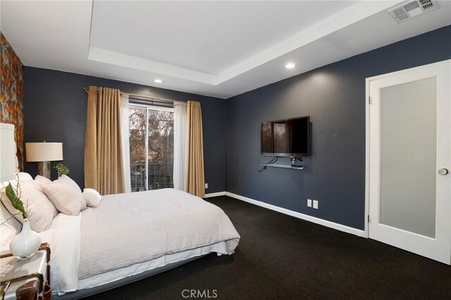 bedroom featuring a tray ceiling