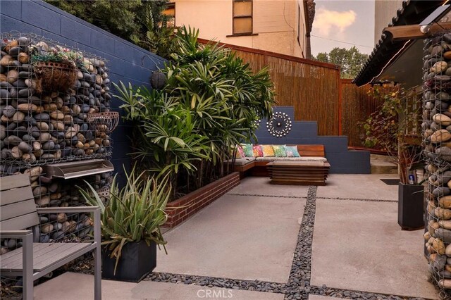 view of patio terrace at dusk