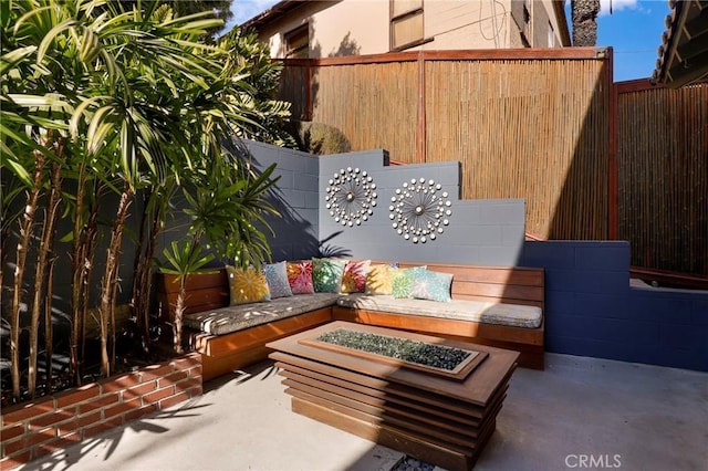 view of patio with a fire pit