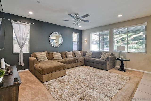 living room with ceiling fan and light tile patterned flooring