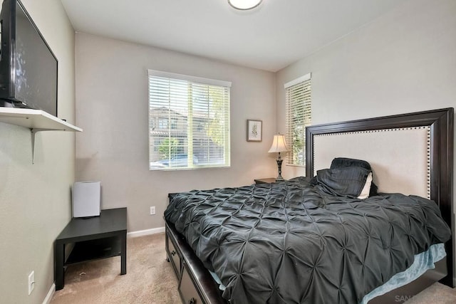 bedroom with light carpet