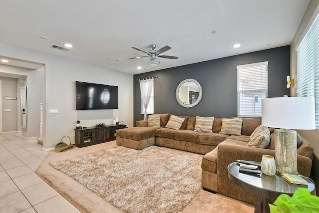 living room featuring ceiling fan and light tile patterned floors