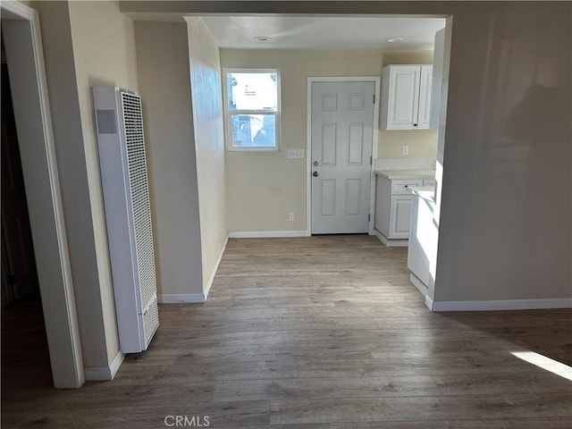 hallway with light hardwood / wood-style flooring