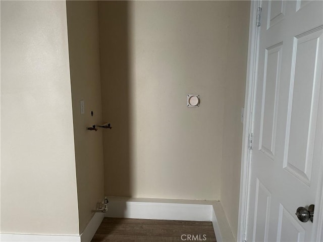 laundry room with hardwood / wood-style flooring