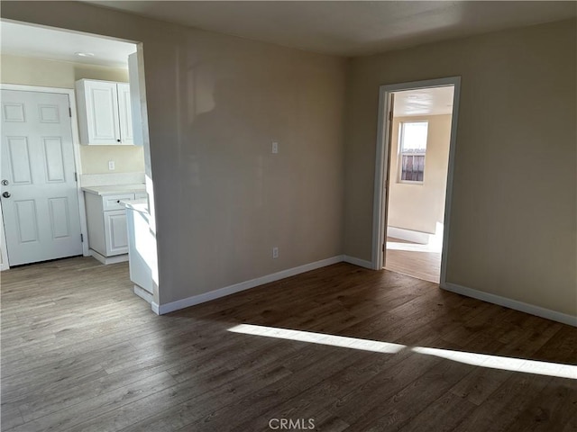 unfurnished room with light wood-type flooring