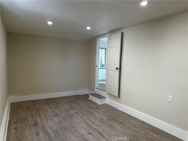 unfurnished room featuring light hardwood / wood-style floors