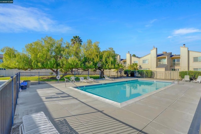 view of swimming pool featuring a patio area