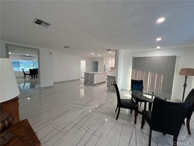 dining room with an AC wall unit