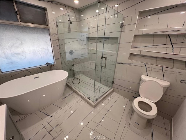 bathroom with toilet, tile walls, and plus walk in shower