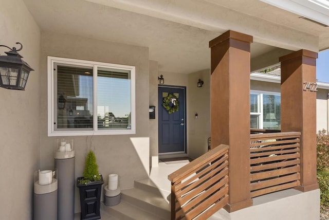 property entrance featuring covered porch