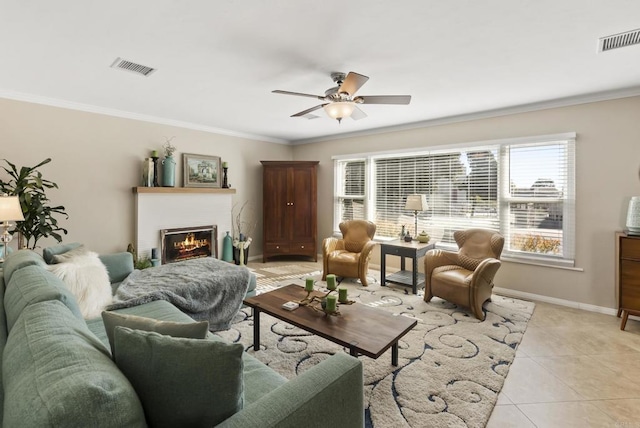 tiled living room featuring crown molding and ceiling fan