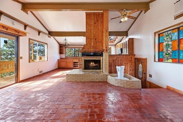 unfurnished living room featuring vaulted ceiling with beams, ceiling fan, and a brick fireplace