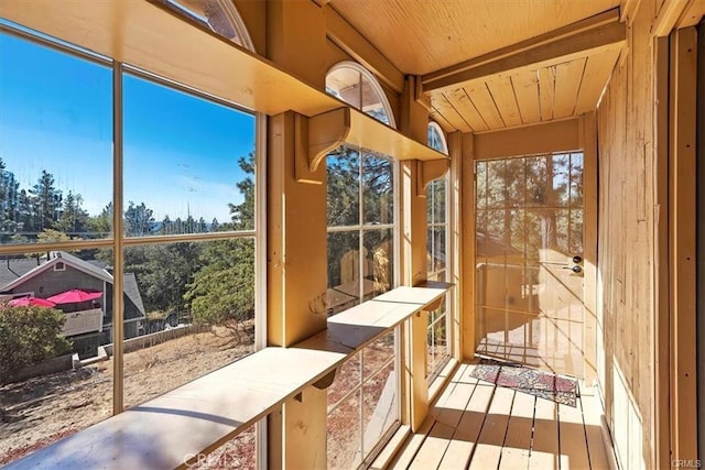 sunroom / solarium with wooden ceiling and a wealth of natural light