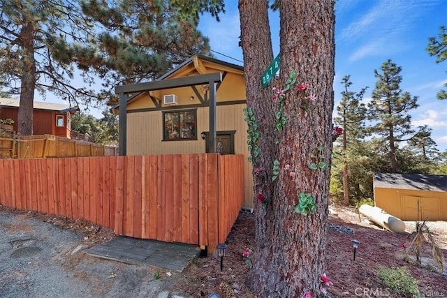 view of home's exterior with a shed