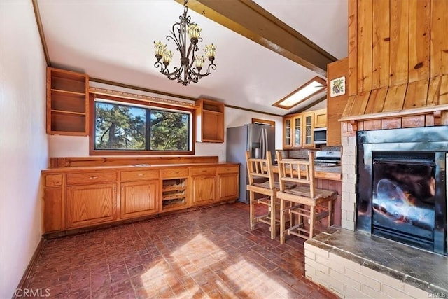 kitchen with an inviting chandelier, lofted ceiling with beams, stainless steel refrigerator with ice dispenser, hanging light fixtures, and range