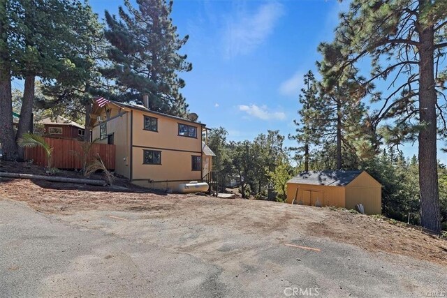 view of side of property featuring an outbuilding