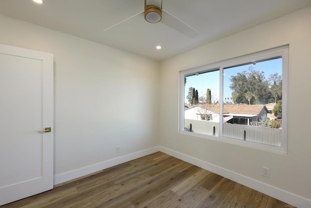 empty room featuring ceiling fan and wood-type flooring