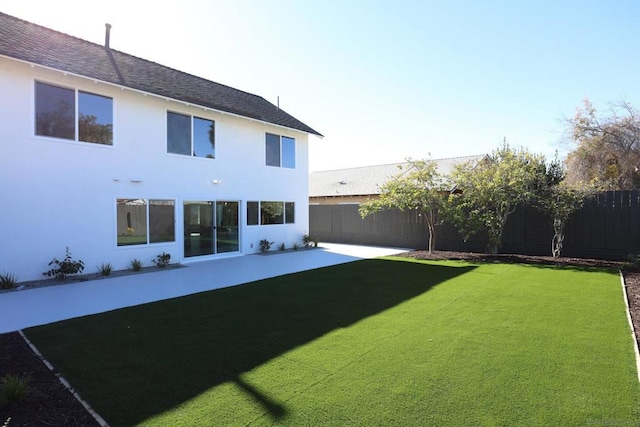 exterior space with a patio area and a yard