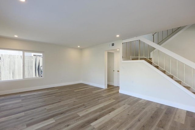 empty room with wood-type flooring