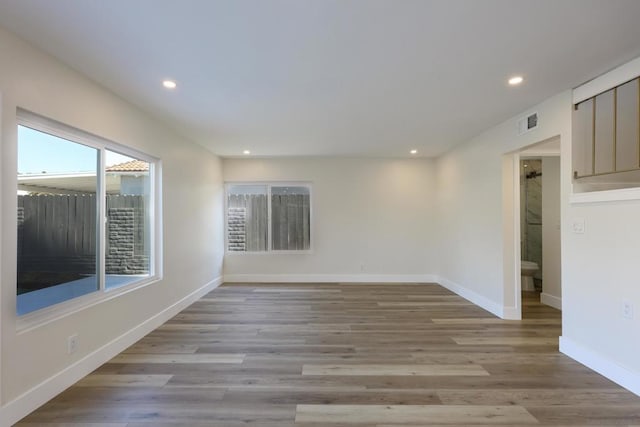 spare room with light hardwood / wood-style floors