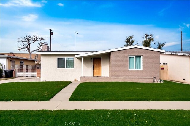 ranch-style house with a front yard