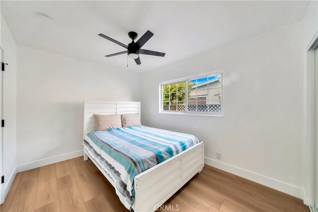 bedroom featuring ceiling fan and wood-type flooring