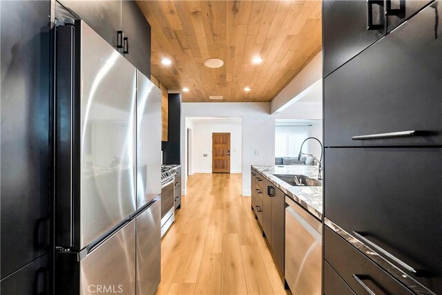 kitchen featuring wood ceiling, light hardwood / wood-style floors, appliances with stainless steel finishes, light stone counters, and sink