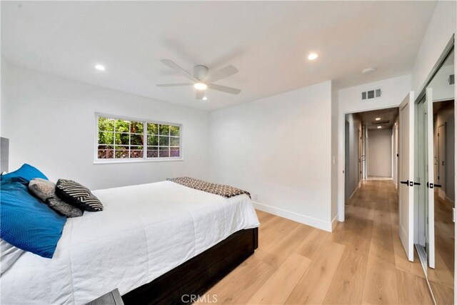 bedroom featuring ceiling fan and light wood-type flooring