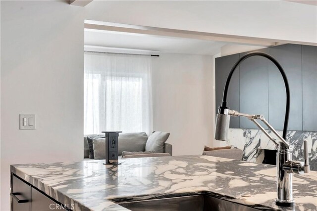 kitchen featuring light stone countertops