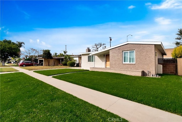 single story home with a front yard