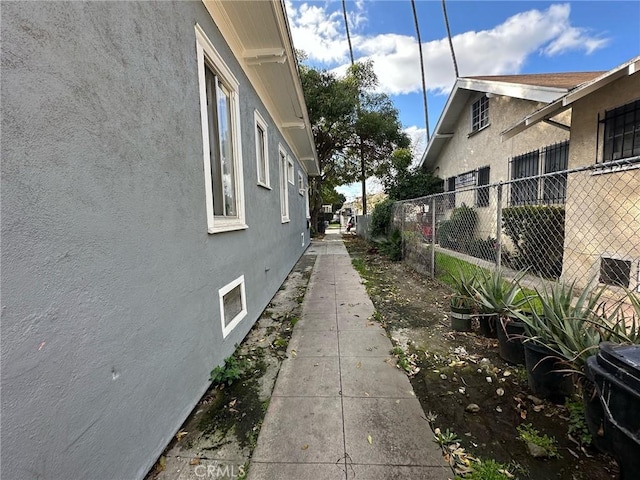 4210 Woodlawn Ave, Los Angeles, CA 90011 - view of side of property featuring stucco siding