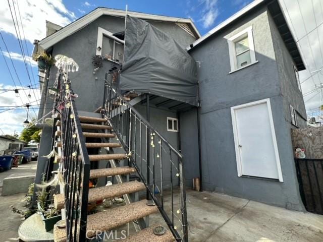 back of house with a patio