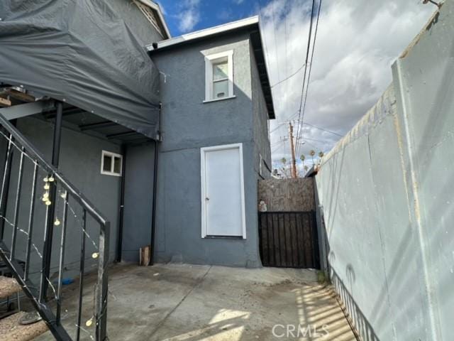 view of side of property with a patio