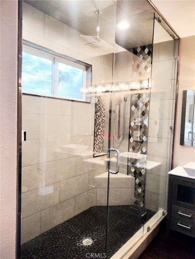 bathroom with vanity and an enclosed shower