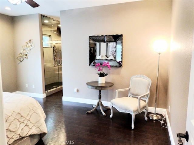 bedroom with dark hardwood / wood-style floors