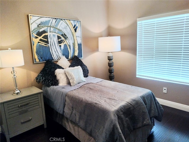 bedroom featuring dark hardwood / wood-style floors