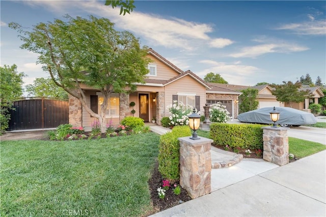 craftsman-style house featuring a garage and a front lawn