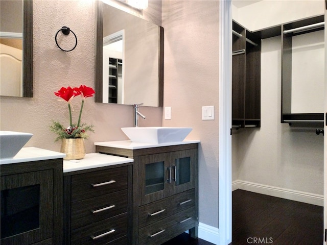 bathroom featuring vanity and hardwood / wood-style floors