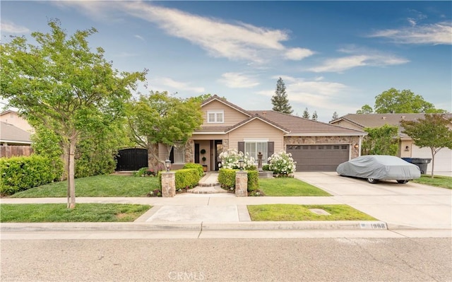 view of front of house featuring a front yard and a garage