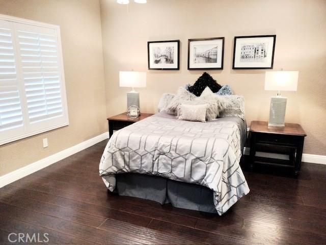 bedroom featuring dark hardwood / wood-style flooring