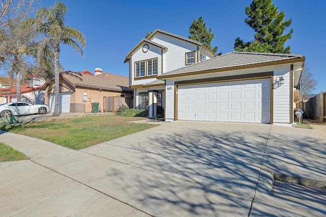 view of property with a front lawn and a garage